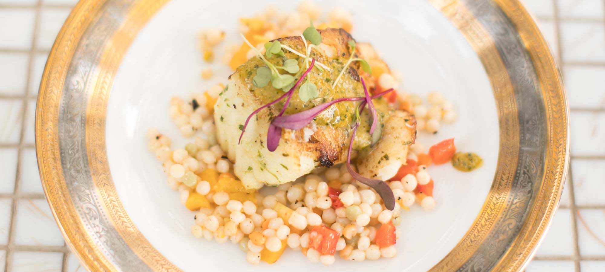 Plated fish dish and cous cous